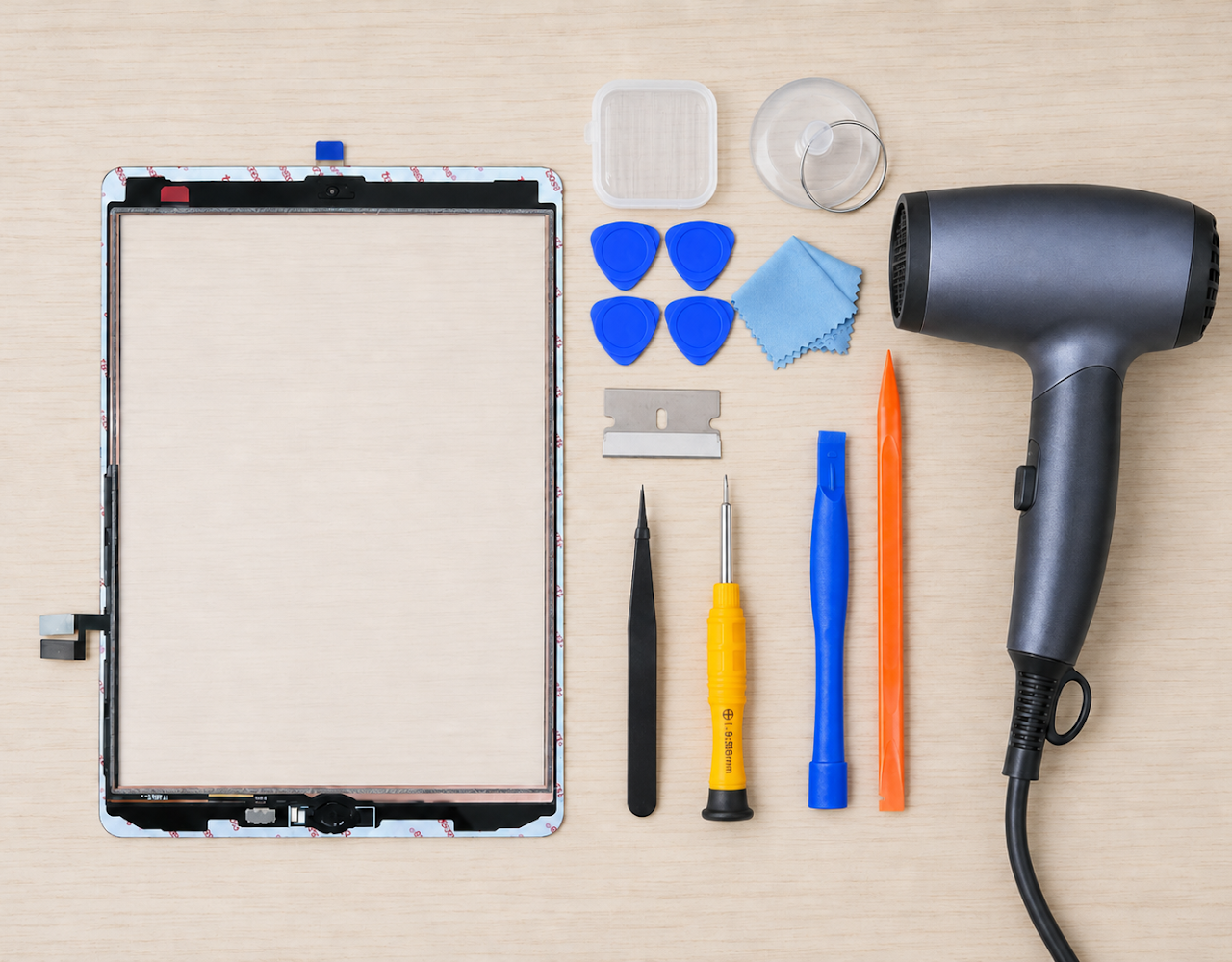 iPad 7, 8, and 9 replacement screen and repair tools arranged before installation
